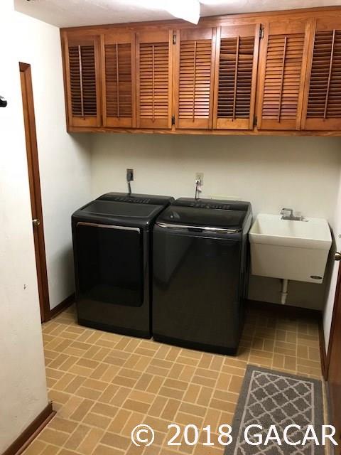 9818 Southwest 1st Place Gainesville, FL 32607 - Photo 20 of 23 Laundry Room with New Appliances