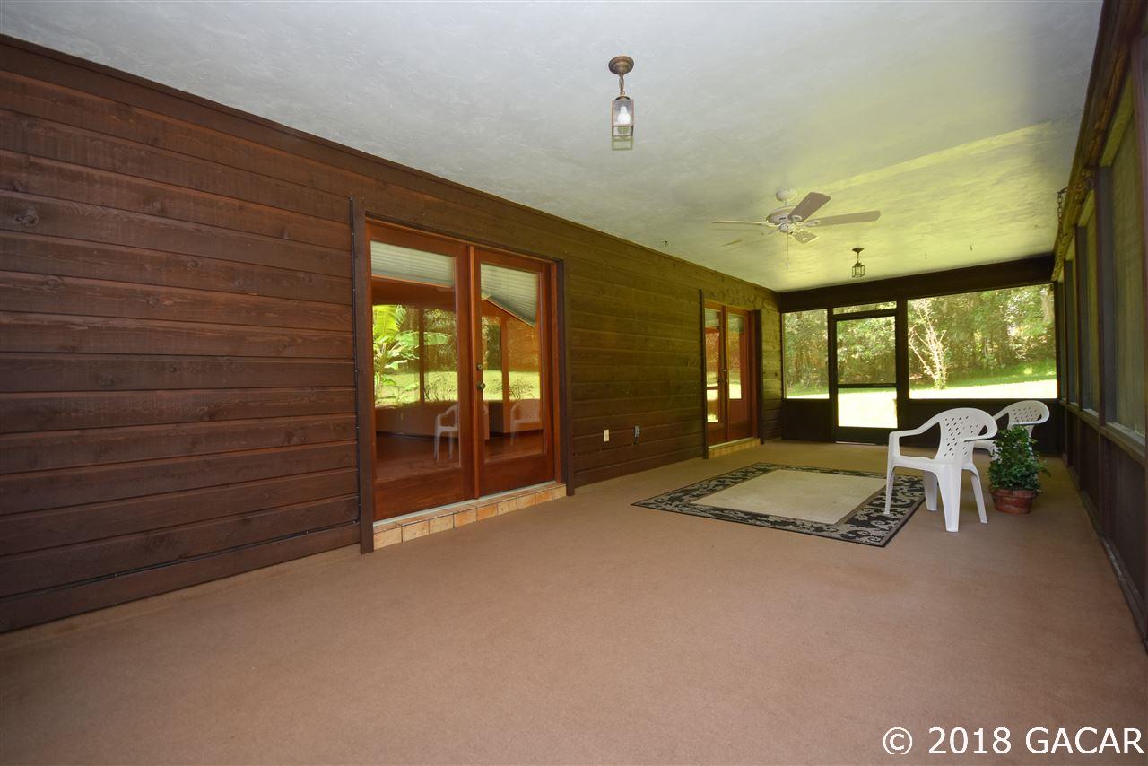9818 Southwest 1st Place Gainesville, FL 32607 - Photo 21 of 23 Rear Screened Lanai