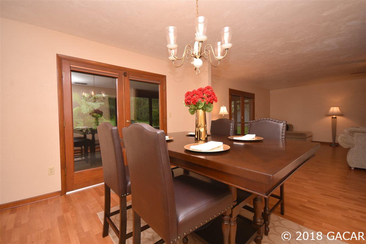 9818 Southwest 1st Place Gainesville, FL 32607 - Photo 9 of 23 Dining Room Looking Into Living Room