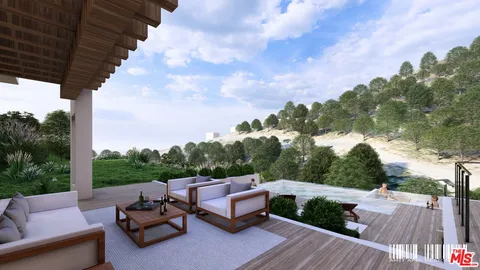 a view of a roof deck with furniture