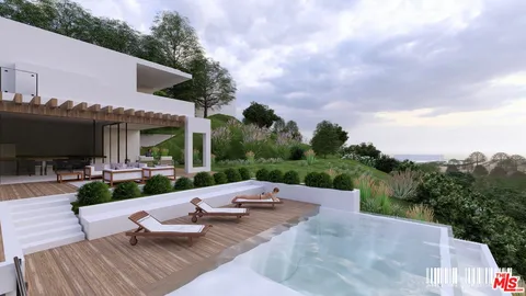 a view of a patio with couches table and chairs with wooden floor and fence
