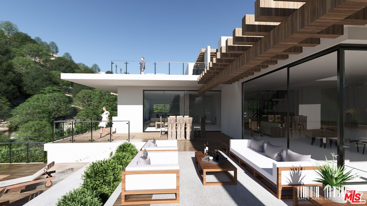 5801 Foxview Drive Malibu, CA 90265 - Photo 6 of 12 a view of a patio with couches table and chairs and potted plants