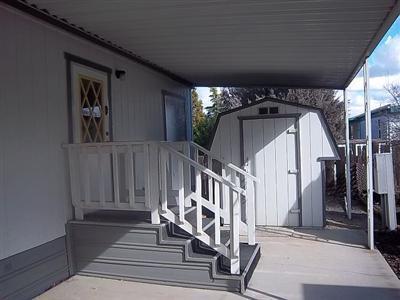 255 Colver Road, Unit 93 Talent, OR 97540 - Photo 3 of 15 carport, back entrance and storage shed