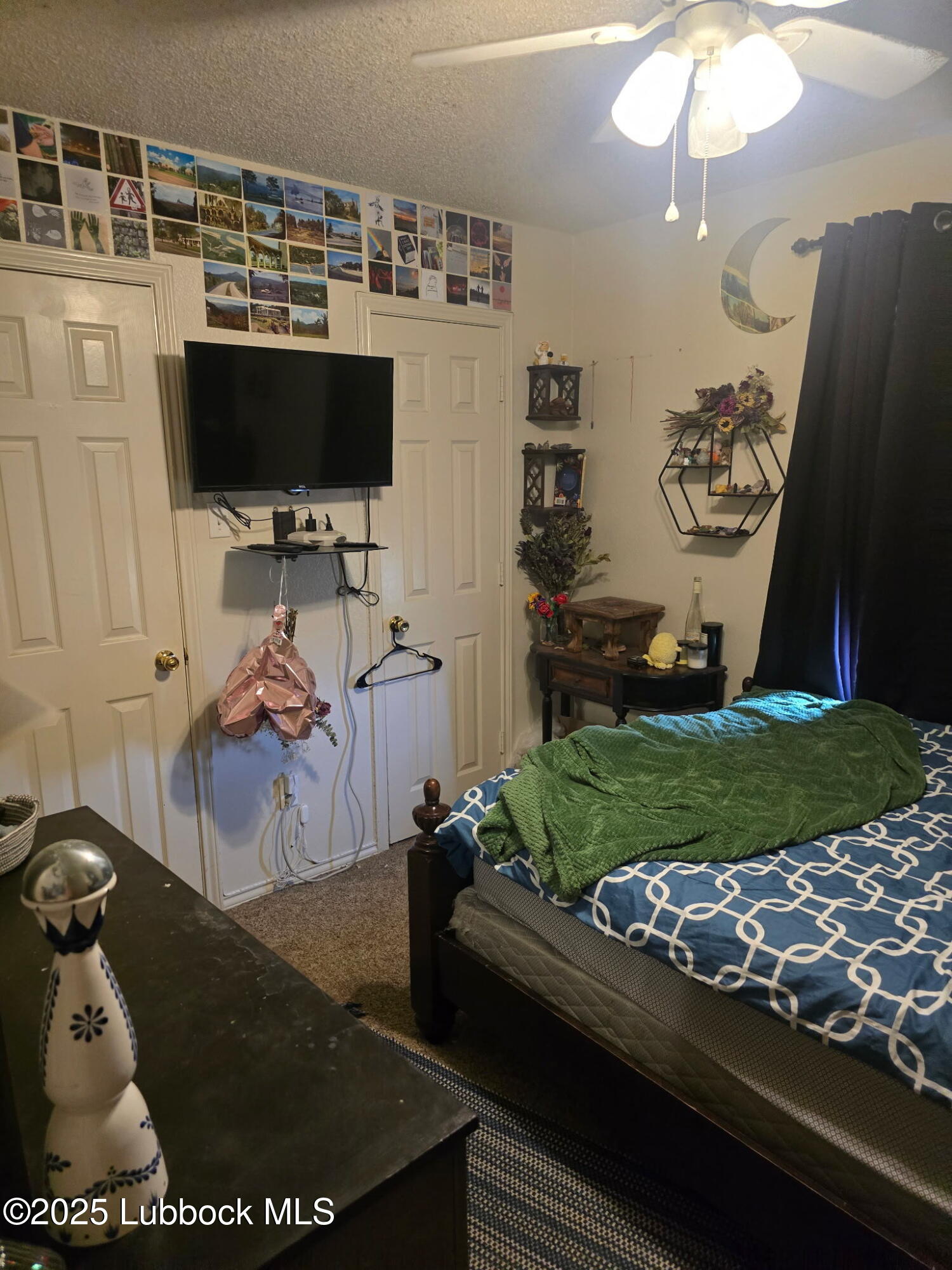 6004 68th Street Lubbock, TX 79424 - Photo 10 of 16 a room with furniture and flat screen tv