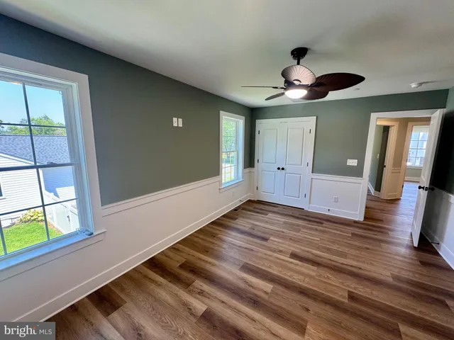 a bathroom with a shower and a glass door