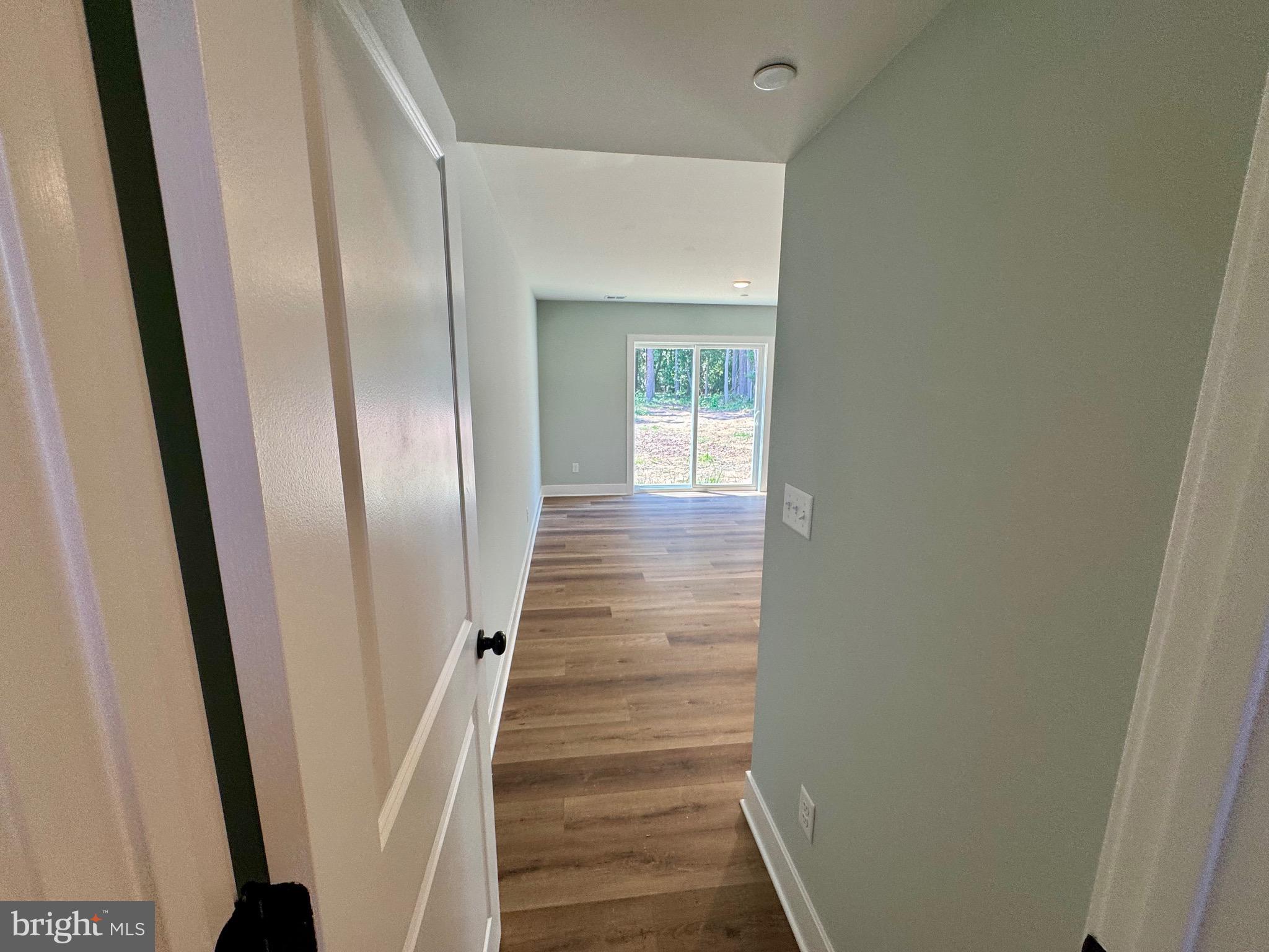 222 Long Point Road Stevensville, MD 21666 - Photo 29 of 44 a view of a hallway with wooden floor and entryway