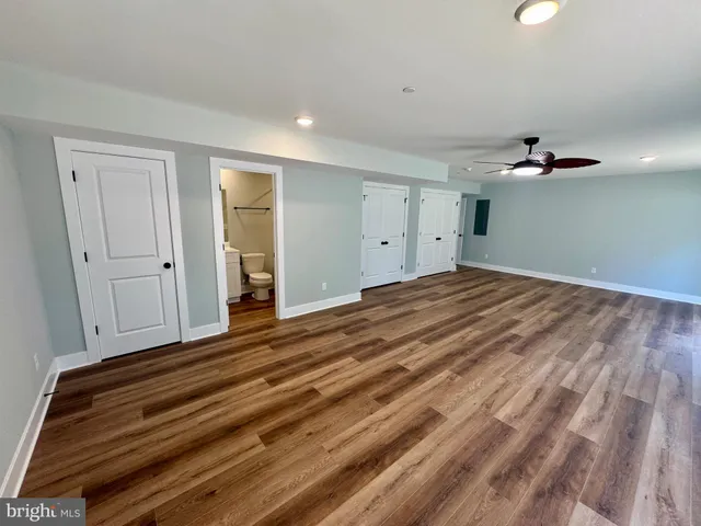 a bathroom with a toilet and a bathtub
