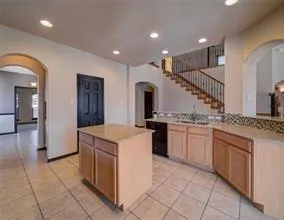 a kitchen with a sink and cabinets