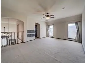 a view of a livingroom with an ceiling fan and a ceiling fan