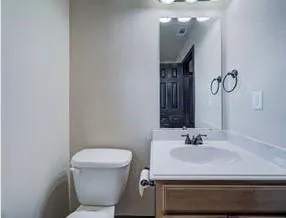 a view of a backyard with tree