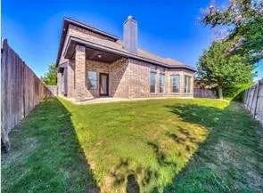 a view of a house with a yard and plants