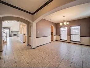 a view of a hallway with chandelier