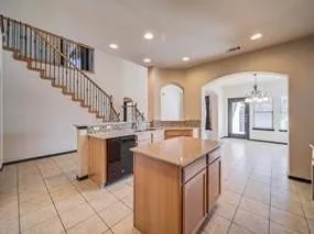 a kitchen with a sink and a stove top oven