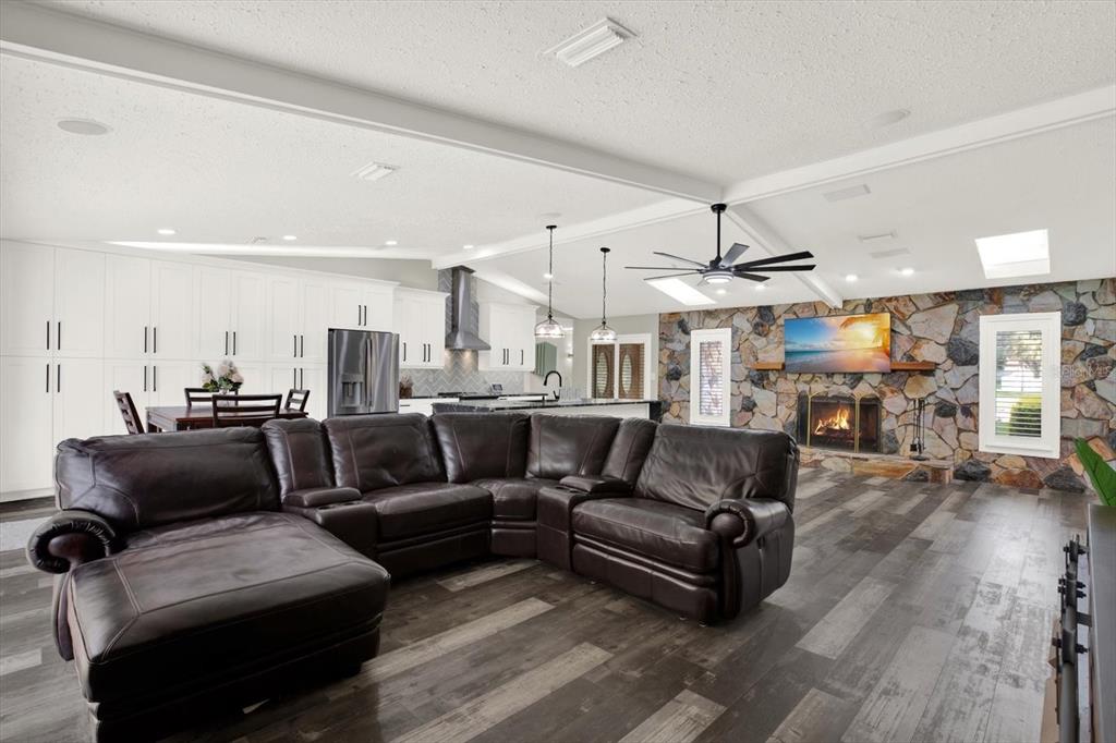 7487 River Country Drive Weeki Wachee, FL 34607 - Photo 23 of 53 a living room with furniture and a wooden floor
