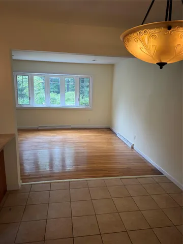 an empty room with a empty space and a window