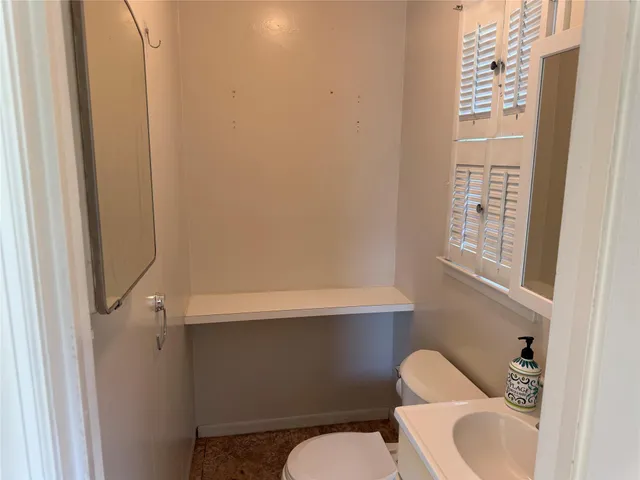 a bathroom with a toilet and a sink