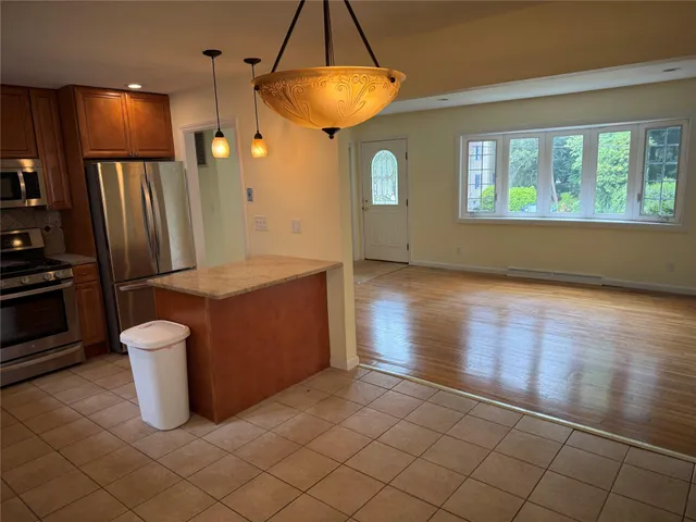 a kitchen with a sink appliances and cabinets