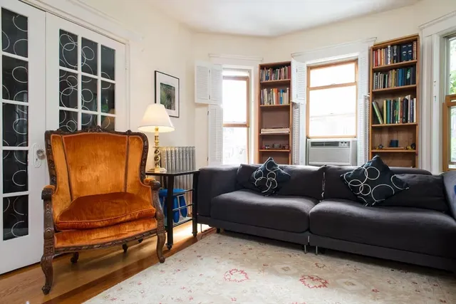 a living room with furniture and a window