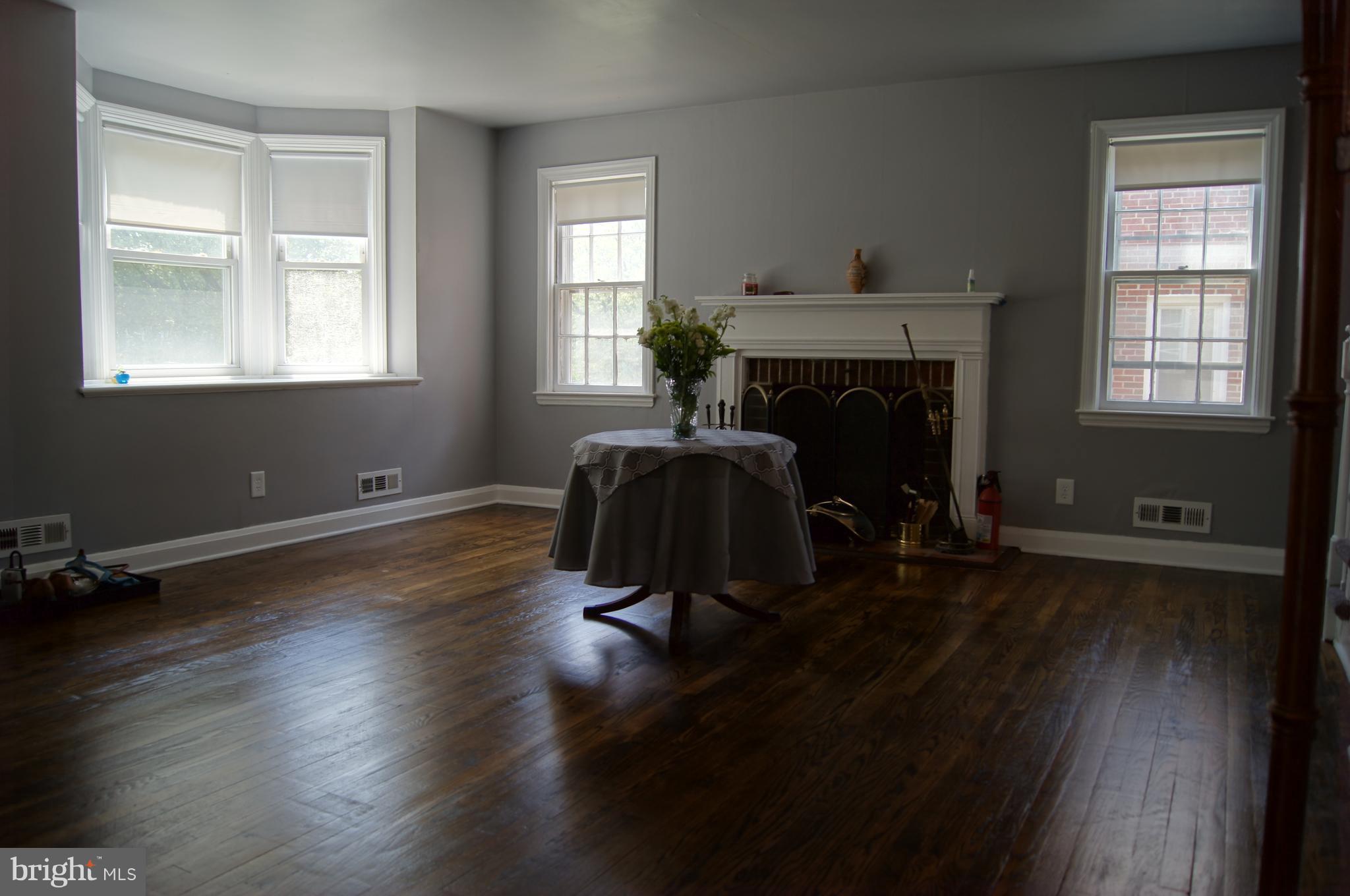 1628 Heathfield Road Baltimore, MD 21239 - Photo 6 of 27 Spacious Living Room w/ Wood Burning Fireplace!
