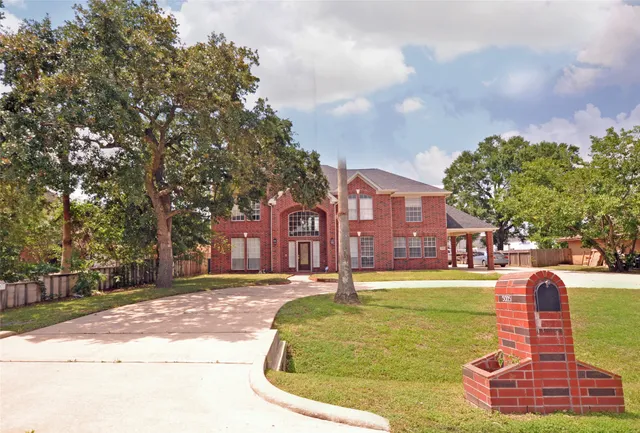 a swimming pool with outdoor seating and yard