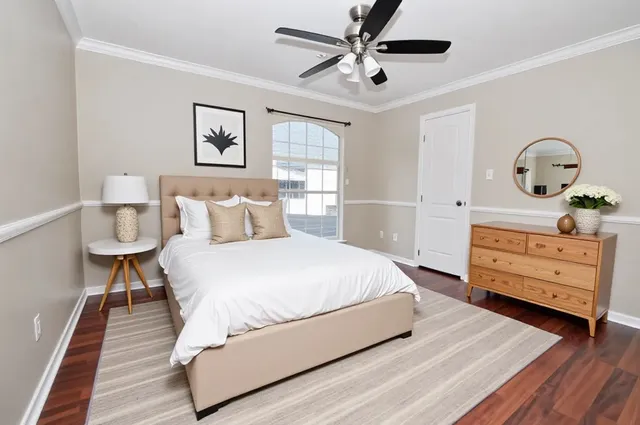 a bedroom with a bed and a dresser