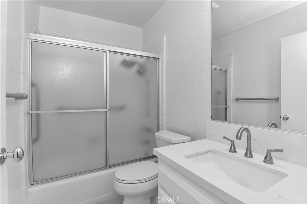 1141 17th Street, Unit 5 Santa Monica, CA 90403 - Photo 31 of 43 a bathroom with a sink toilet and shower