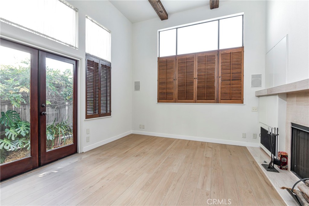 1141 17th Street, Unit 5 Santa Monica, CA 90403 - Photo 10 of 43 a view of an empty room with a window and wooden floor