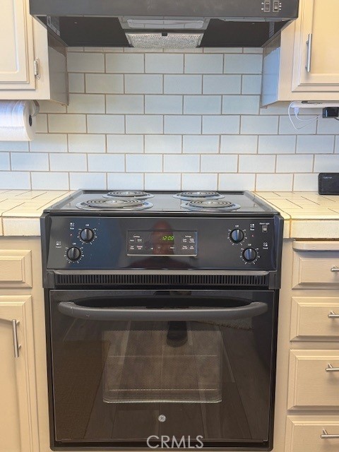 557 Lucerne Street Cayucos, CA 93430 - Photo 51 of 51 New stove/oven and hood