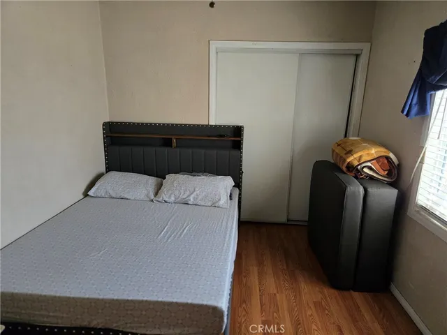 a bedroom with a bed and a mirror