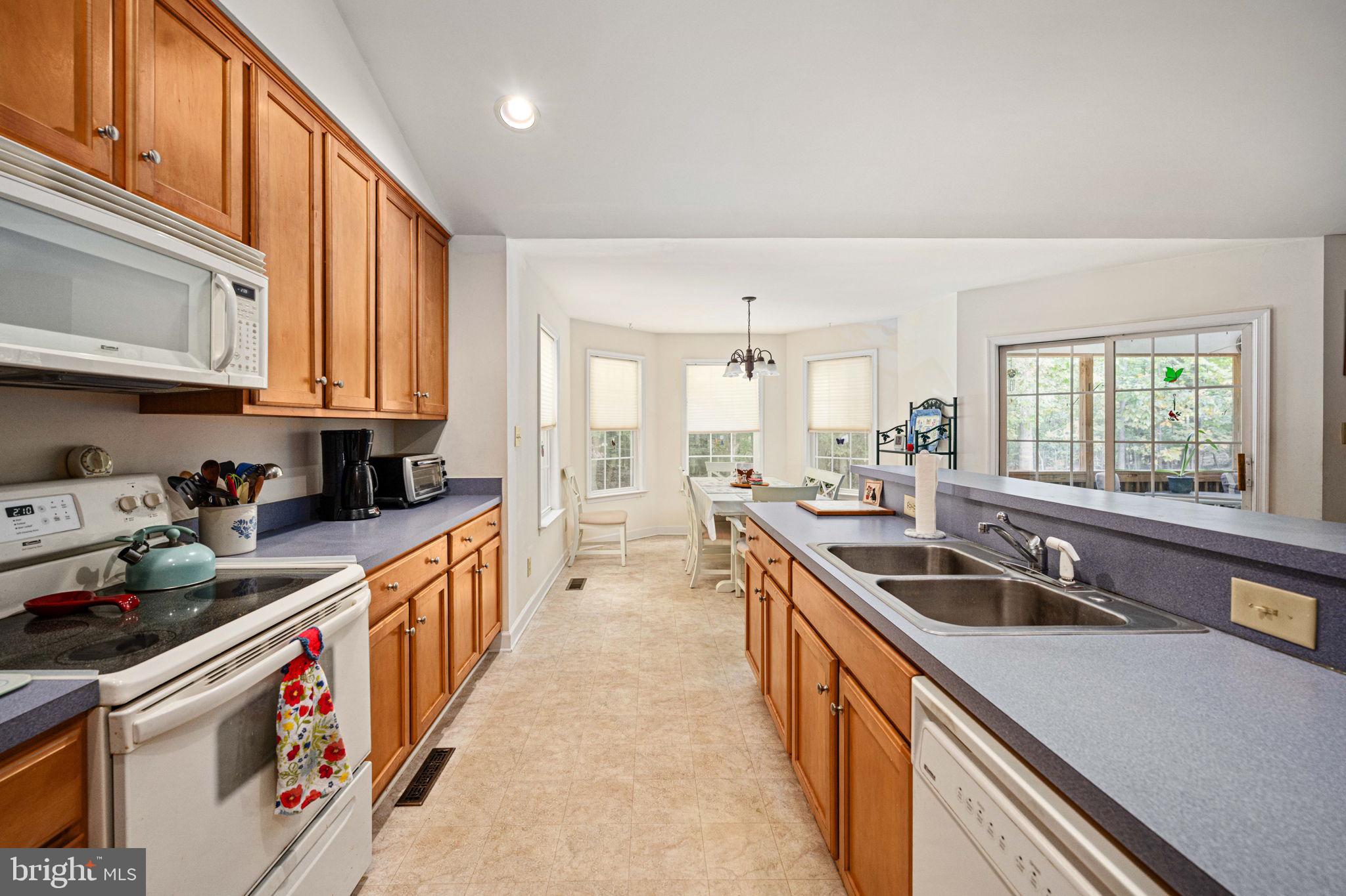 209 Edgemont Lane Locust Grove, VA 22508 - Photo 13 of 48 a kitchen with stainless steel appliances granite countertop a sink and a stove