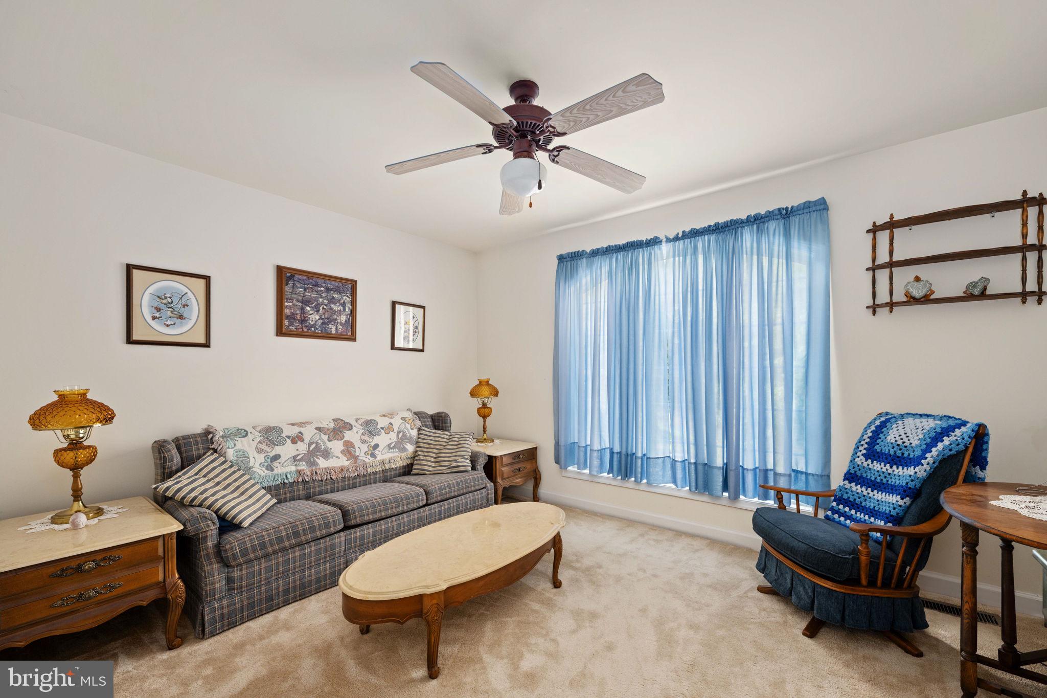 209 Edgemont Lane Locust Grove, VA 22508 - Photo 20 of 48 a living room with furniture and a ceiling fan