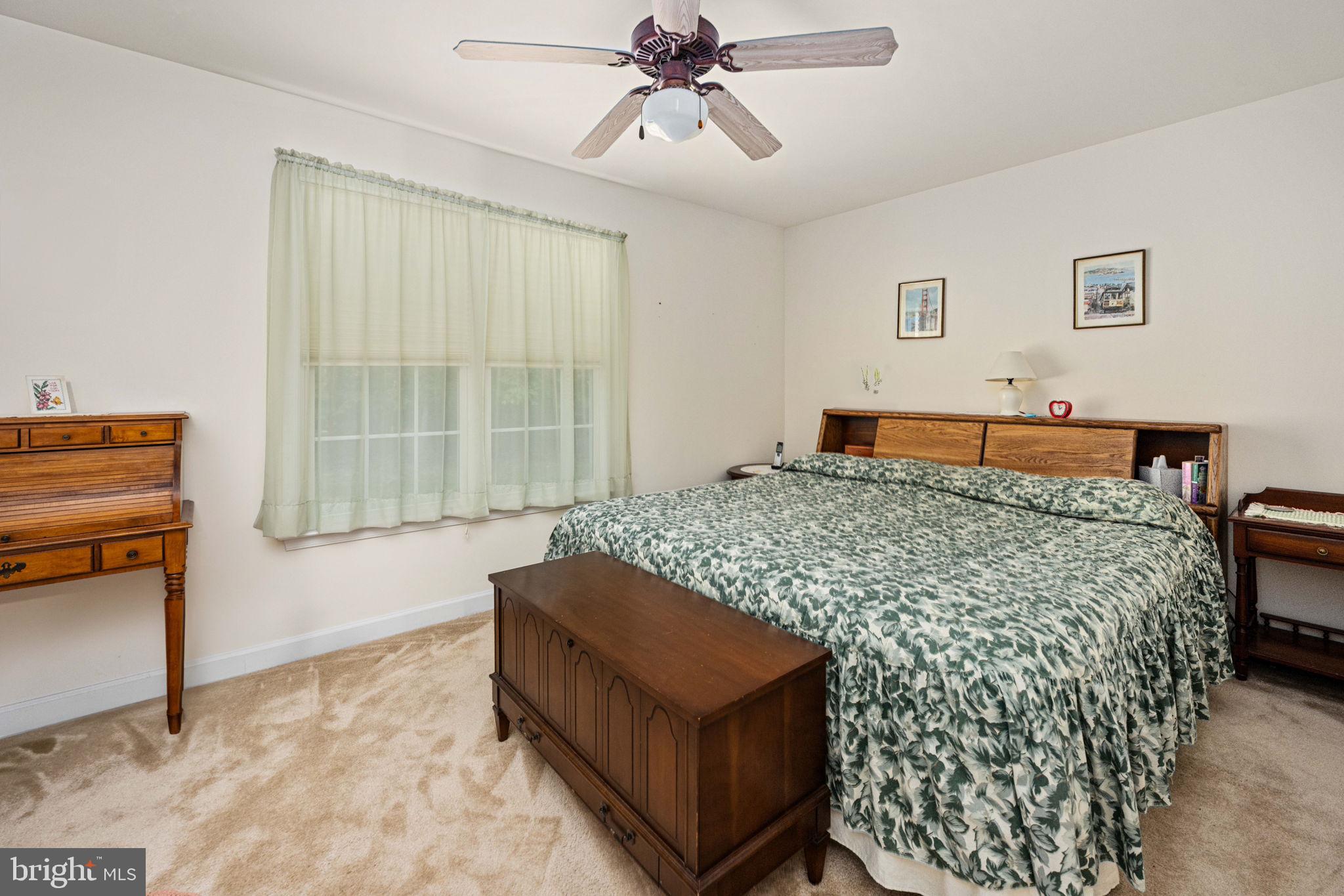 209 Edgemont Lane Locust Grove, VA 22508 - Photo 21 of 48 a bedroom with a bed and a chandelier