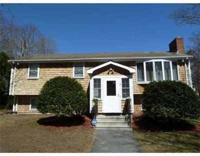2 Quamhassett Road Buzzards Bay, MA 02532 - Photo 1 of 12 a front view of a house with a yard