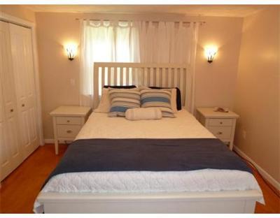 2 Quamhassett Road Buzzards Bay, MA 02532 - Photo 5 of 12 a bedroom with a bed and a window