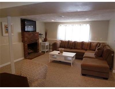2 Quamhassett Road Buzzards Bay, MA 02532 - Photo 6 of 12 a living room with furniture and a fireplace
