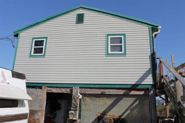 a view of a garden with a house
