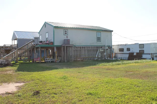 a balcony view with two chairs