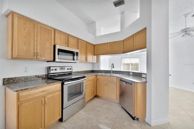 a kitchen with a stove oven and sink