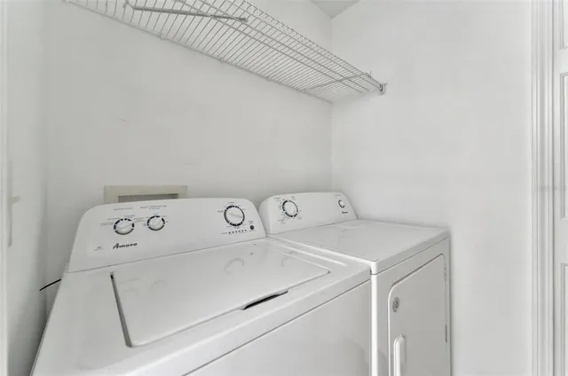a view of a kitchen with a sink and dishwasher cabinets