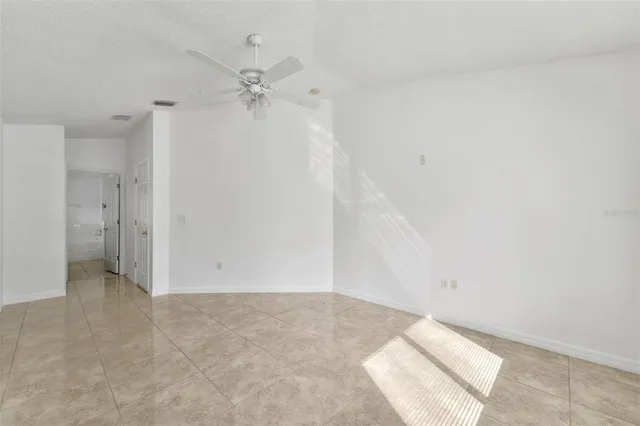 a bathroom with a sink double vanity granite tub and a mirror