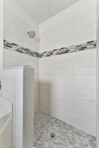 a white bath tub sitting in a bathroom
