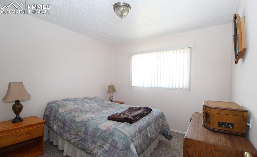 210 4th Street Fowler, CO 81039 - Photo 15 of 18 a bedroom with a bed and a window