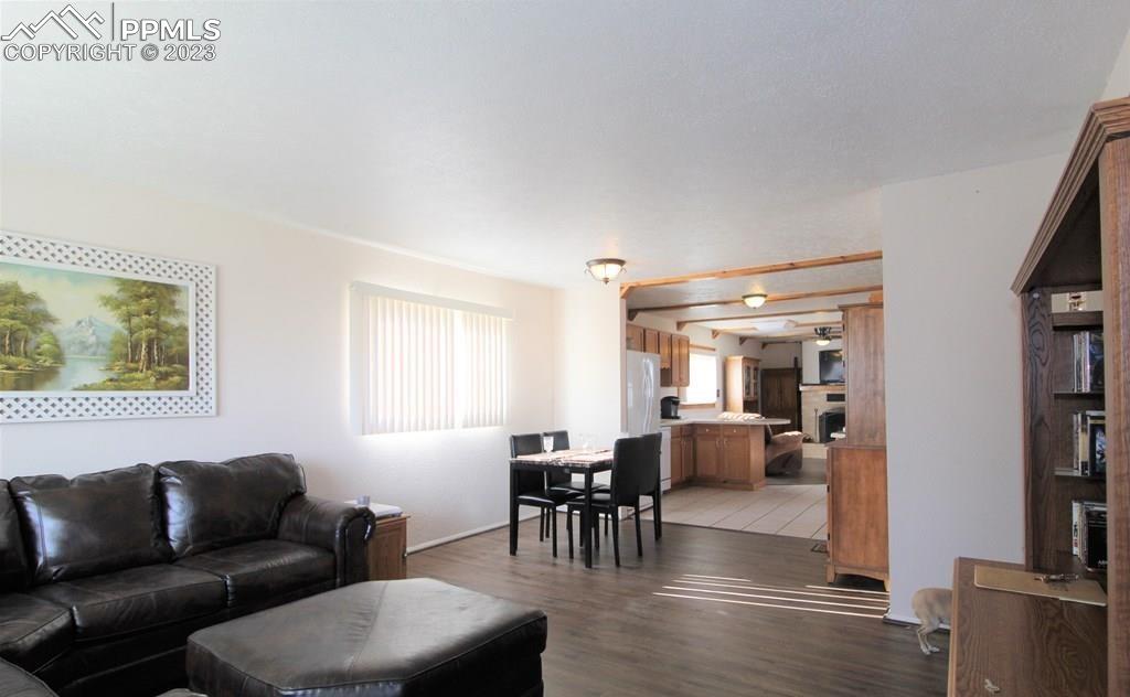 210 4th Street Fowler, CO 81039 - Photo 3 of 18 a living room with furniture and view of kitchen