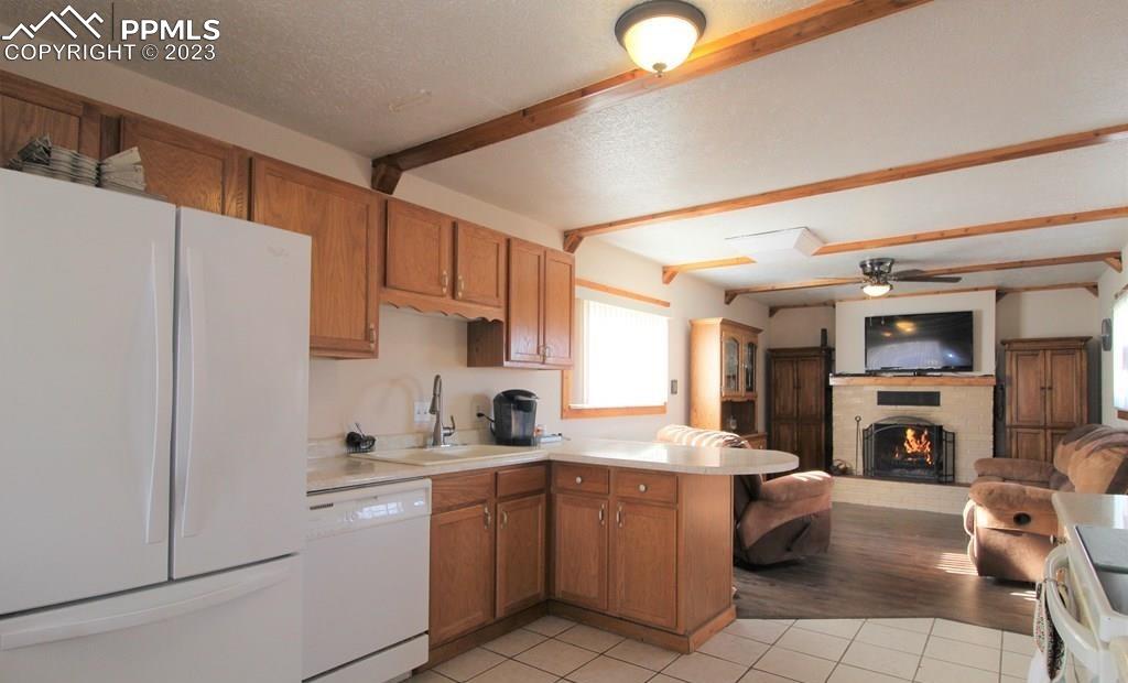 210 4th Street Fowler, CO 81039 - Photo 6 of 18 a kitchen with refrigerator a stove and a sink