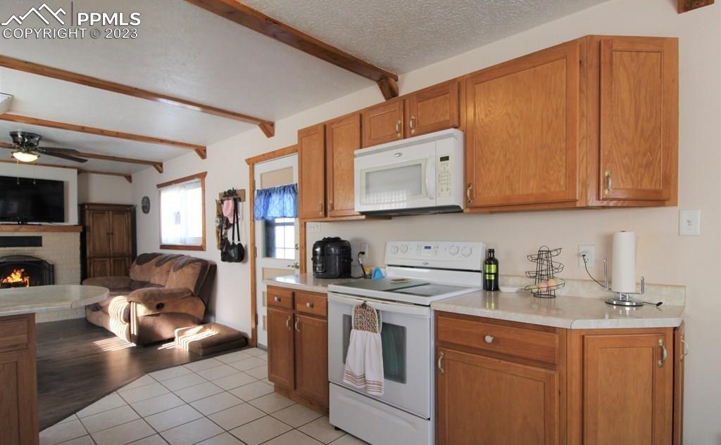 210 4th Street Fowler, CO 81039 - Photo 7 of 18 a kitchen with stainless steel appliances granite countertop a sink stove and cabinets