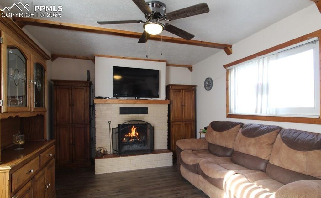 210 4th Street Fowler, CO 81039 - Photo 9 of 18 a living room with furniture and a flat screen tv