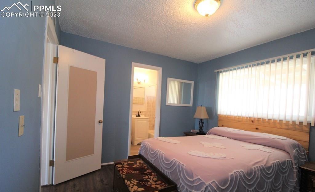 210 4th Street Fowler, CO 81039 - Photo 10 of 18 a bedroom with a bed and a window