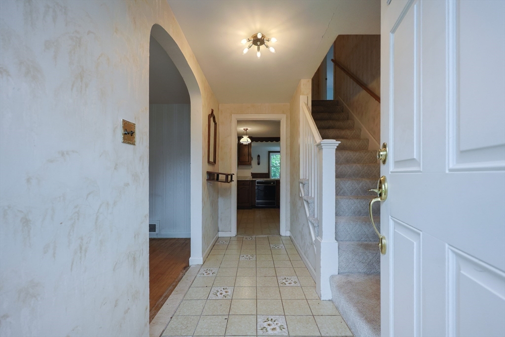 17 Sagamore Road Belmont, MA 02478 - Photo 18 of 35 a view of a hallway with wooden floor and a living room