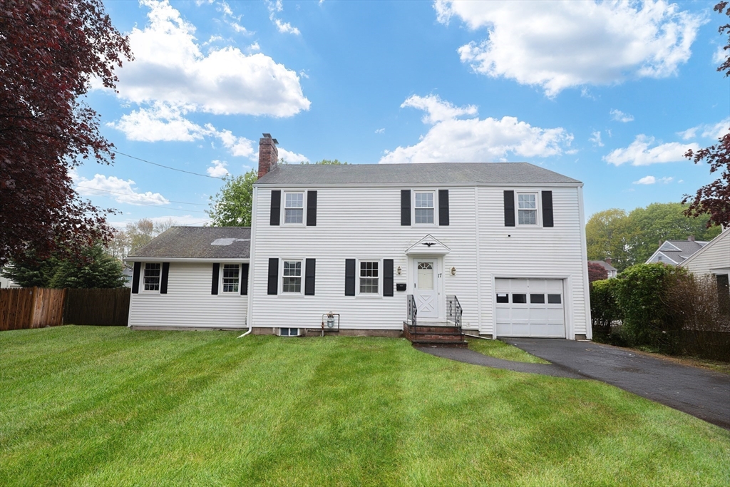 17 Sagamore Road Belmont, MA 02478 - Photo 2 of 35 a view of a white house with a big yard and large trees
