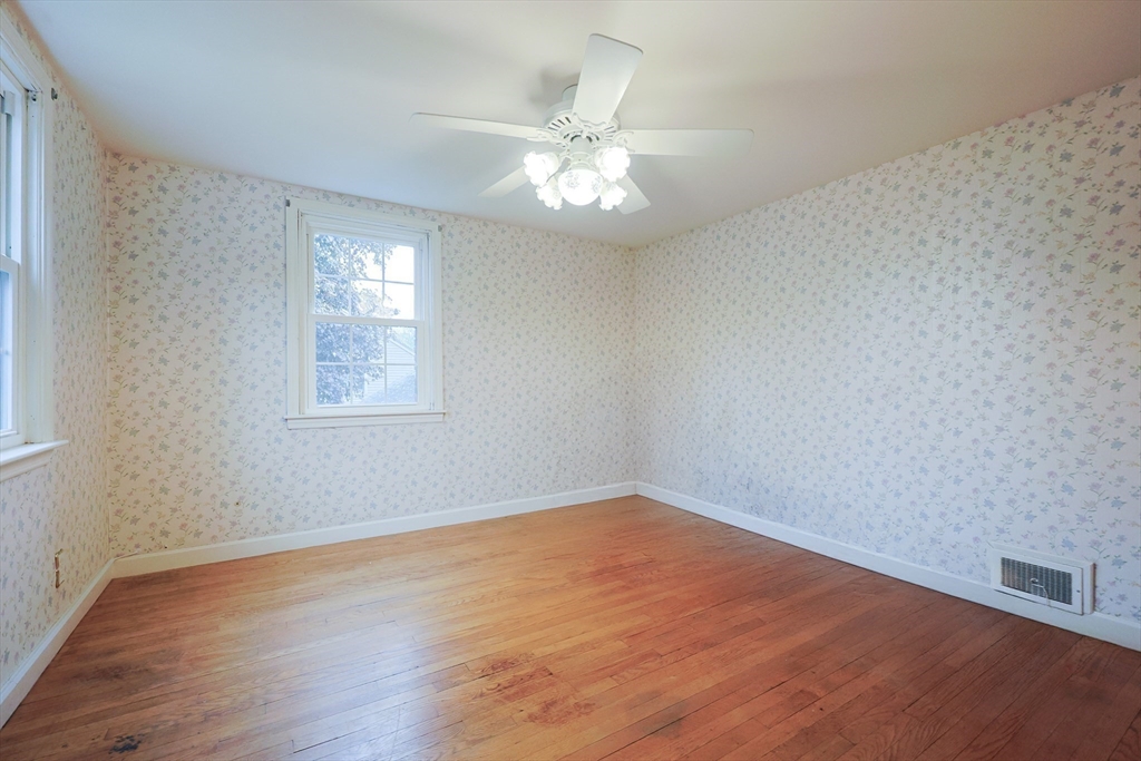 17 Sagamore Road Belmont, MA 02478 - Photo 21 of 35 an empty room with wooden floor fan and windows